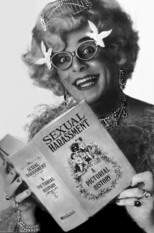 a picture of Dame Edna Everage reading literature